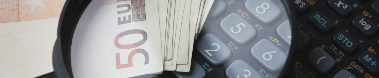 calculate-calculator-close-up-magnifying-glass-221174